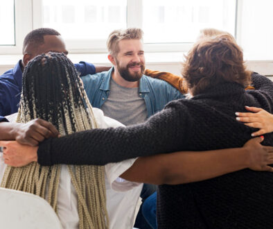 medium-shot-people-hugging-meeting (1)