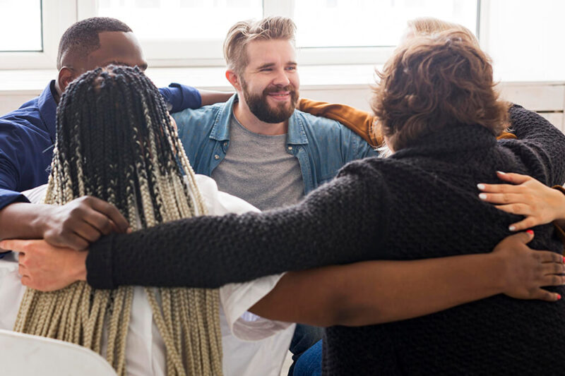 medium-shot-people-hugging-meeting (1)